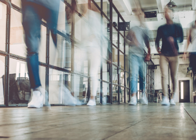 People walking on a tile floor